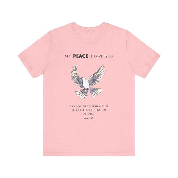 a pink t-shirt with a dove flying and text on it