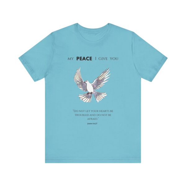 a blue t-shirt with a dove flying and text on it