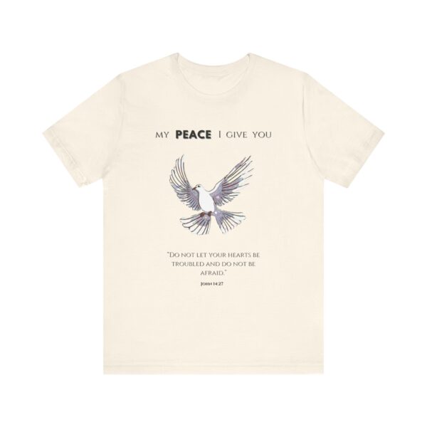 a beige t-shirt with a dove flying and text on it