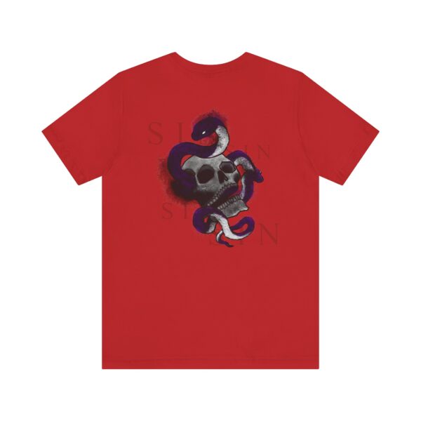 the back of a red t-shirt with a snake inside a skull and text around it