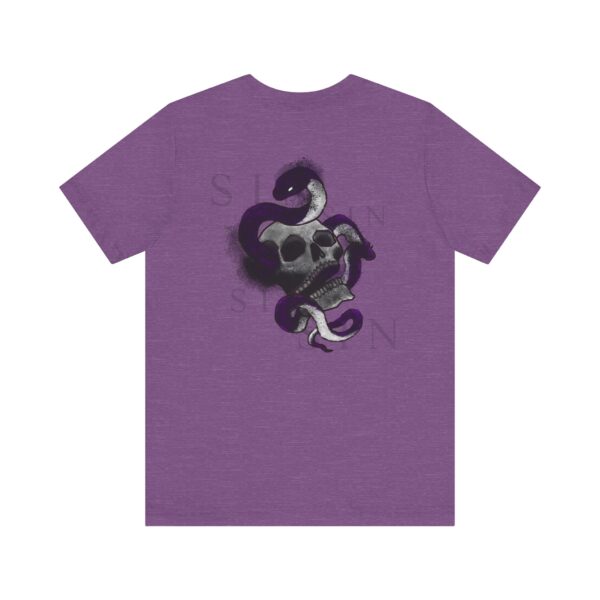 The back of a purple t-shirt with a snake inside a skull and text around it