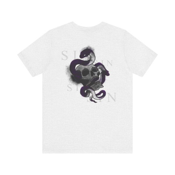 the back of a white t-shirt with a snake inside a skull and text around it
